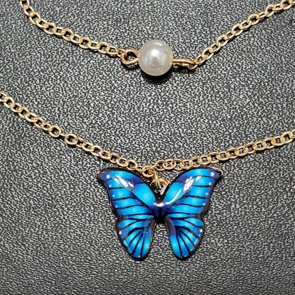 Gold tone blue butterfly earrings & necklace set